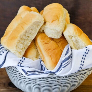 stacked vegan Haitian Bread in basket.