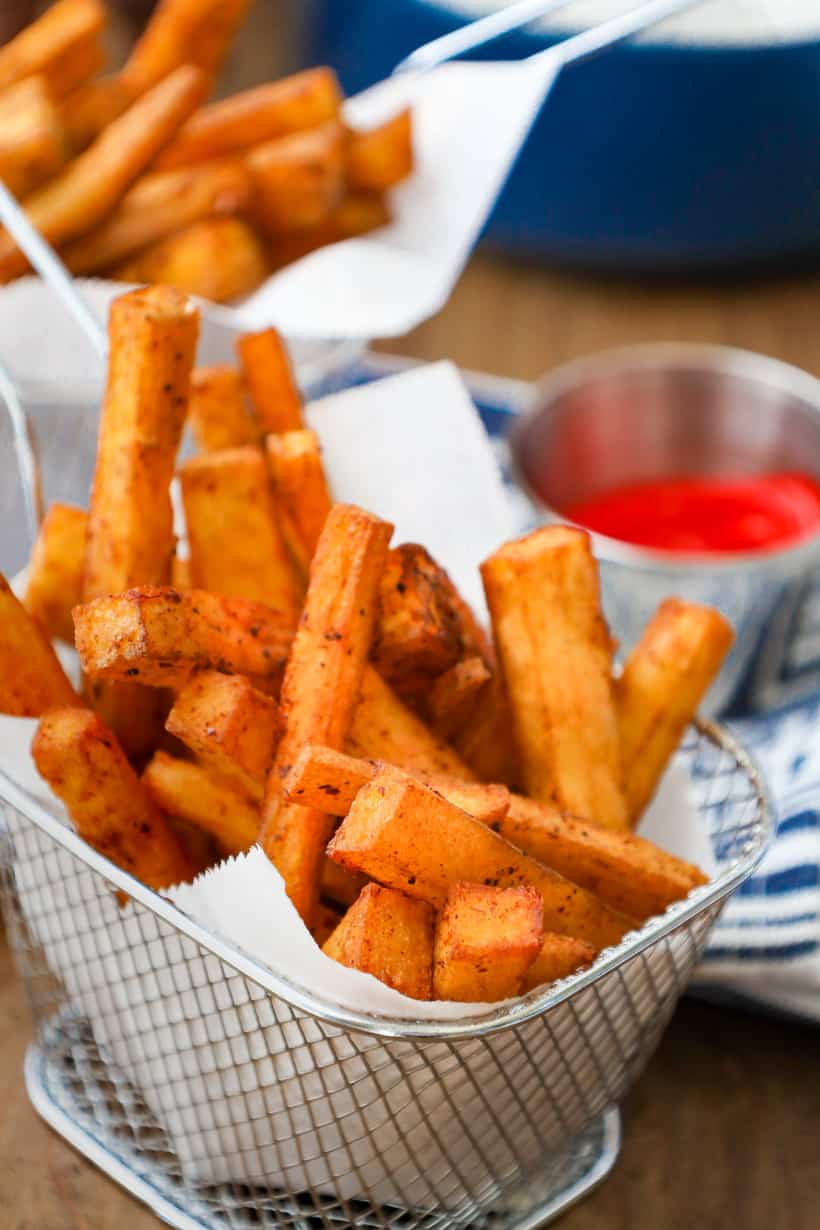 two baskets filled with fries made from yellow yams