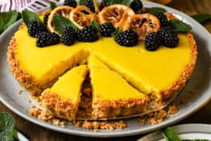 slices of lemon tart topped with fruits and candied lemon