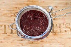 blackberry puree in sieve