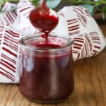 blackberry puree dropping from spoon