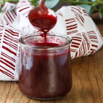 blackberry puree dropping from spoon