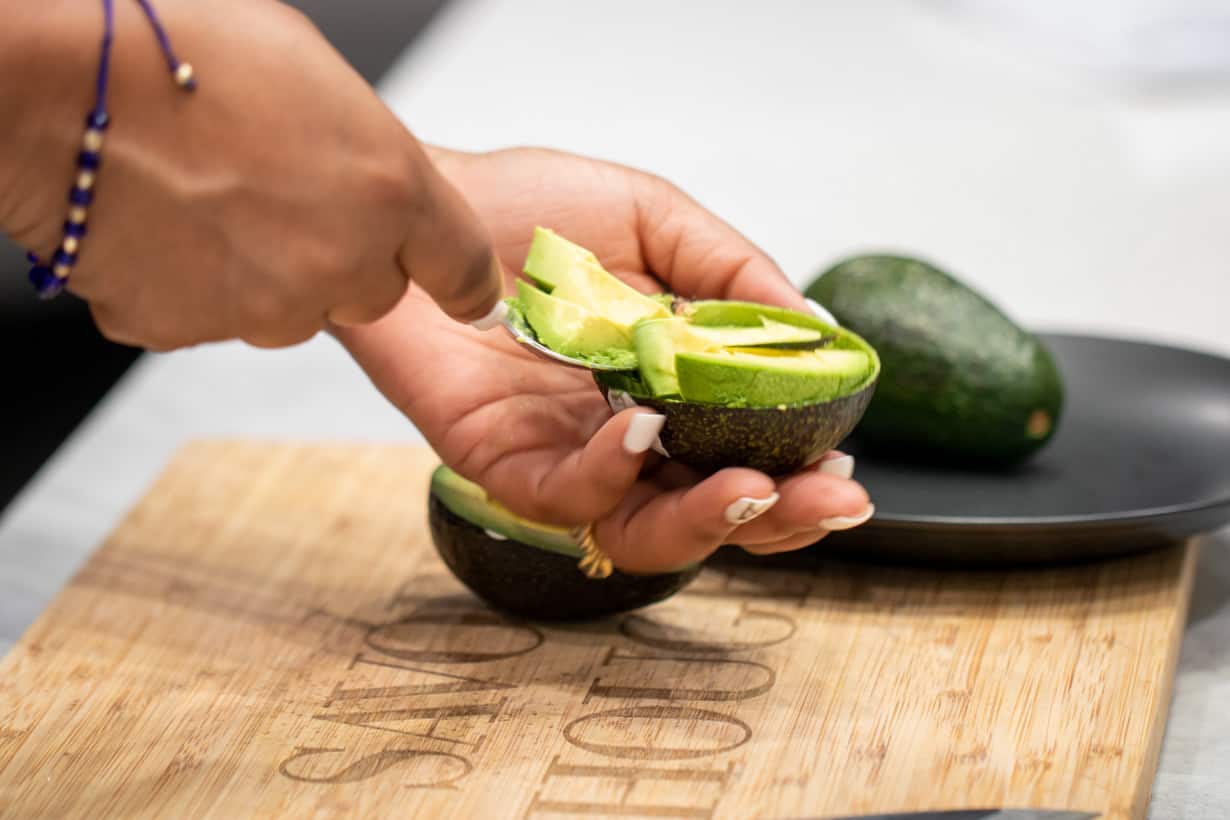 hand slicing avocado