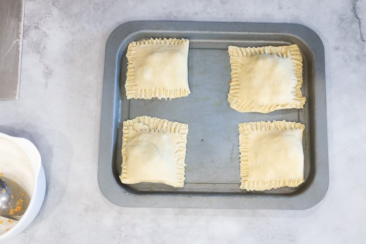 uncooked patties on tray