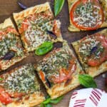 TART AND HERBS ON WOODEN BOARD