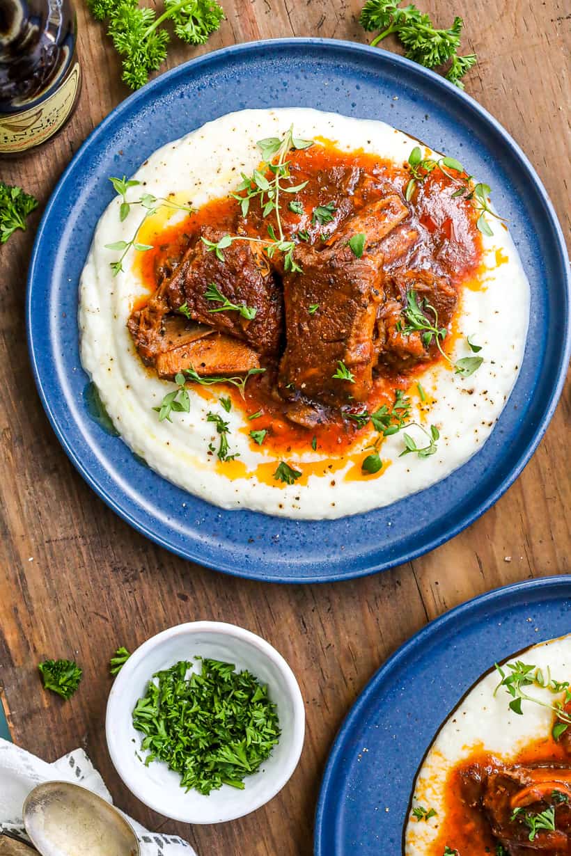 Delicious ribs Guinness recipe in the instant pot on blue plate over mashed potatoes