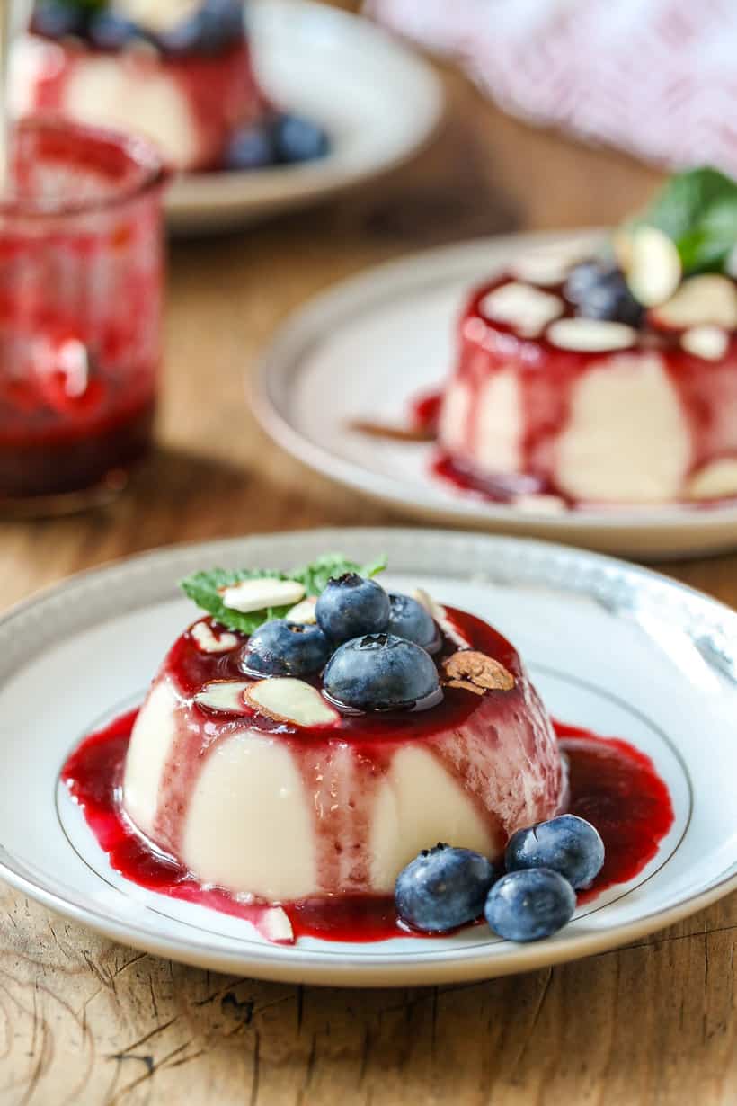 almond milk Panna Cotta with berry coulis and shaved almond