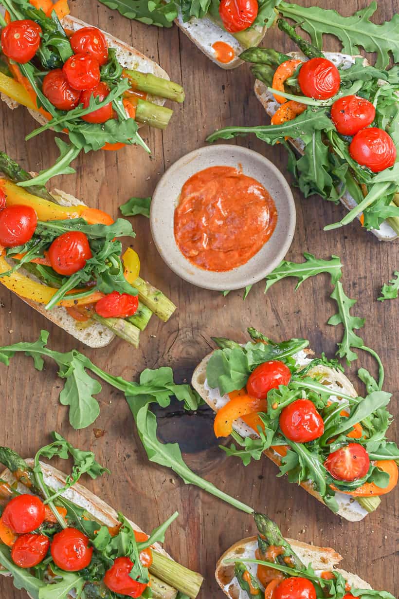 Vegetable Bruschetta on wooden board with chili sauce