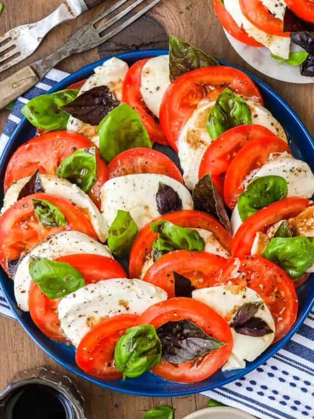 Delicious Caprese Salad Recipe on blue plate with wooden fork