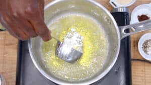 Adding flour to oil and butter
