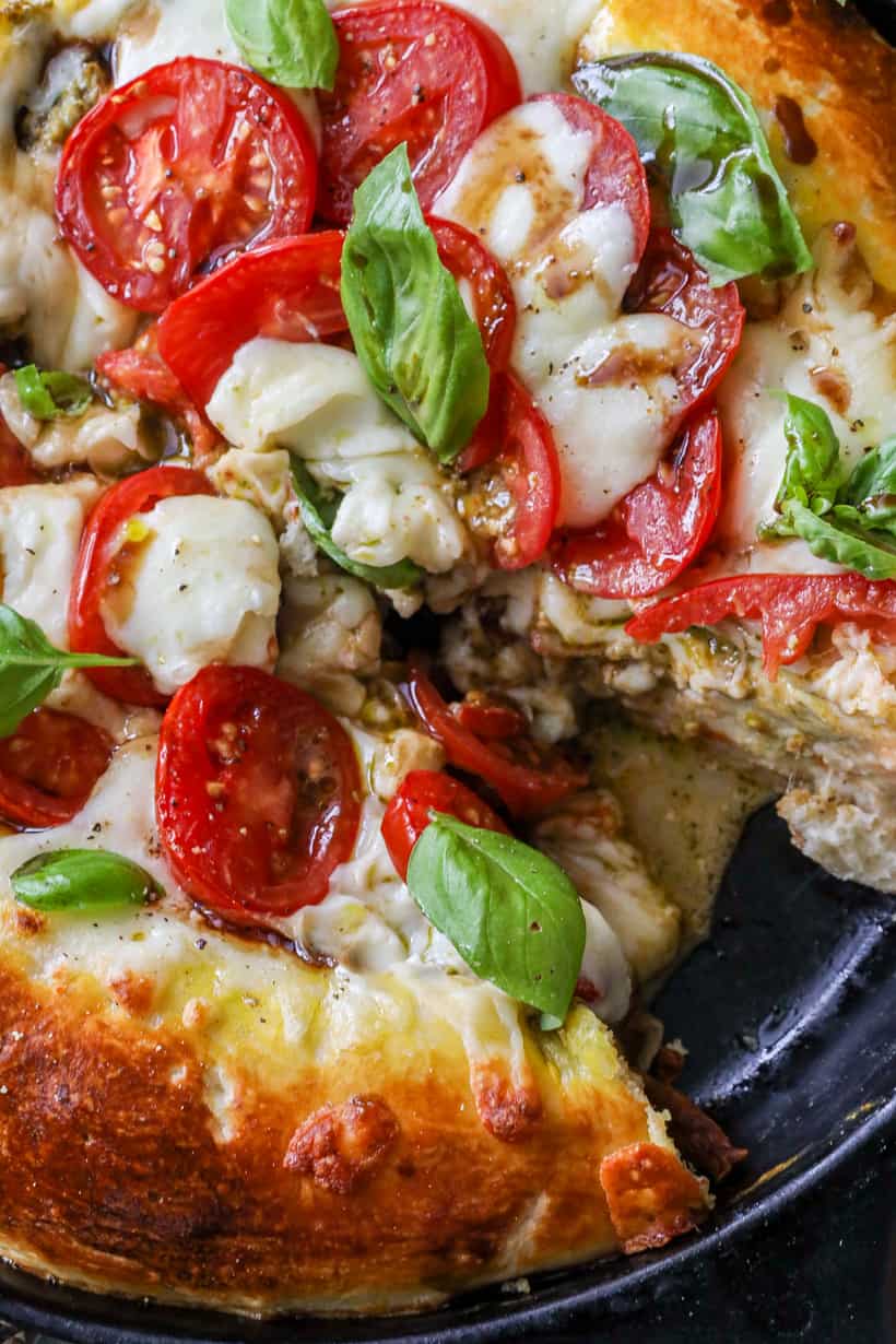cut out piece of caprese pizza