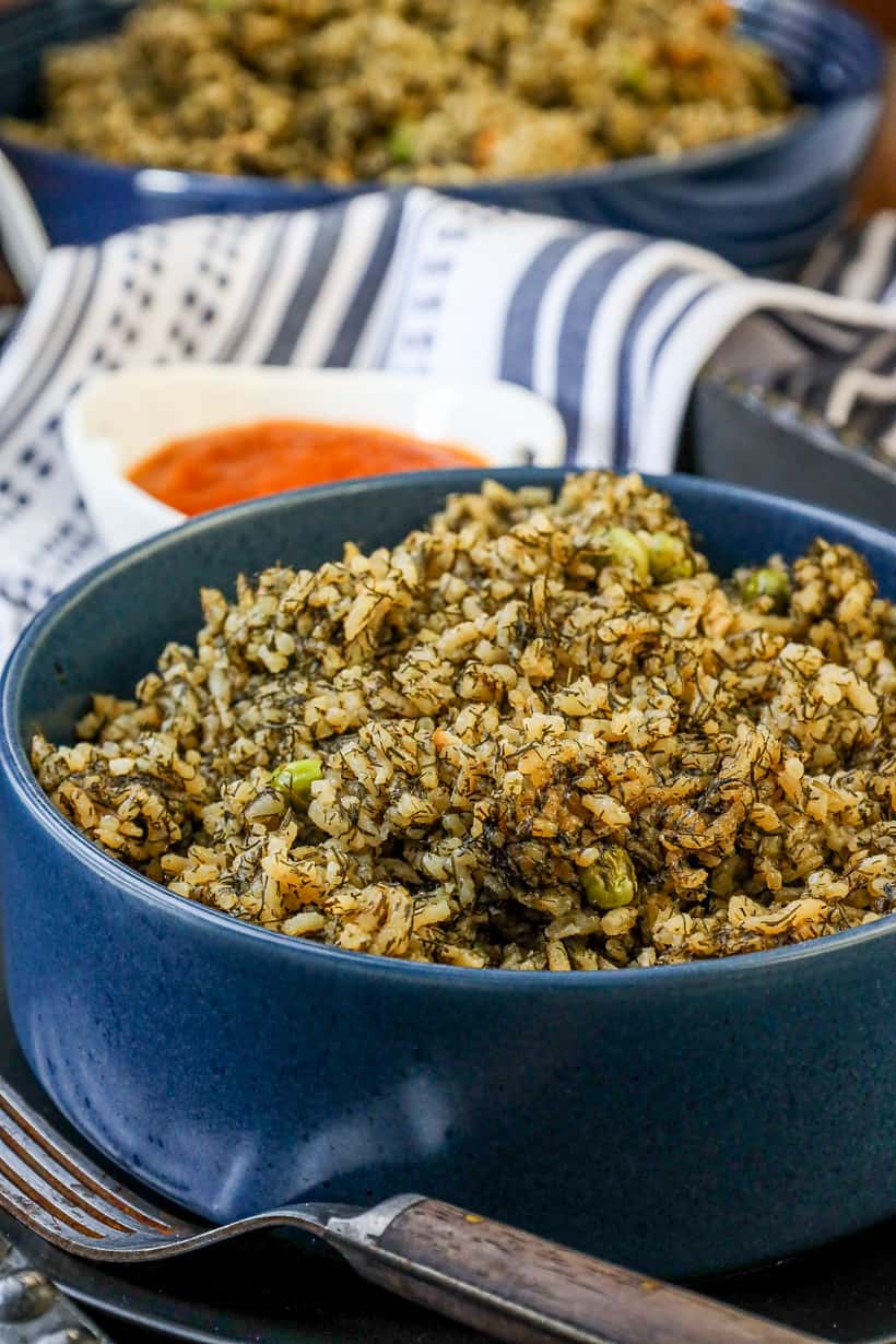 dill rice on blue bowl with fork