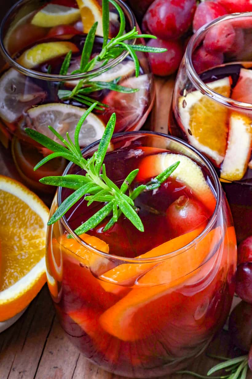 sangria glasses with fruits and herbs
