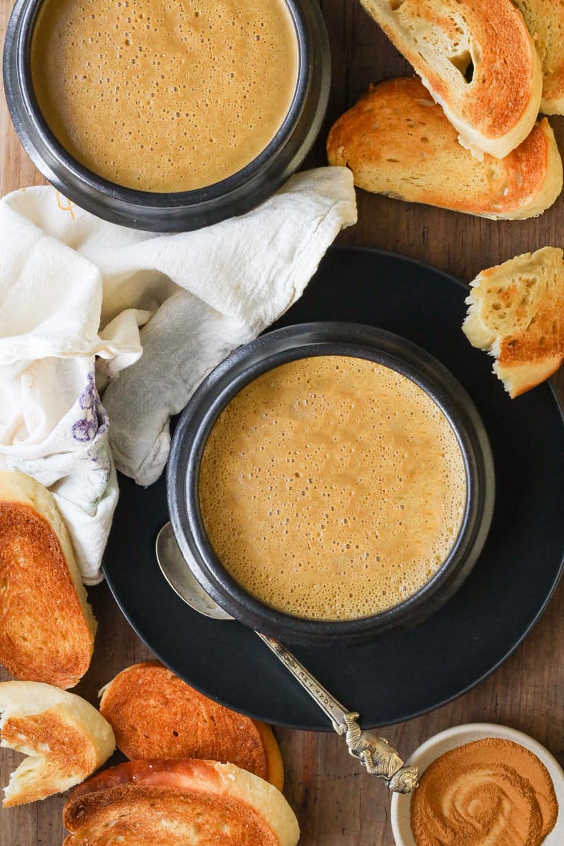 plantain porridge in black bowls