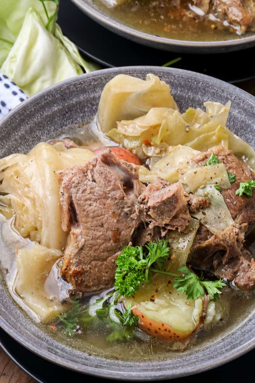 slow cooker lamb stew in gray bowl