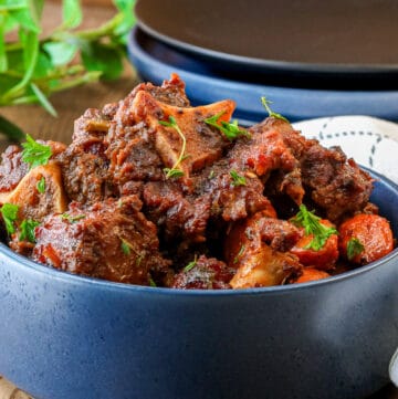 smoked oxtail in blue bowl