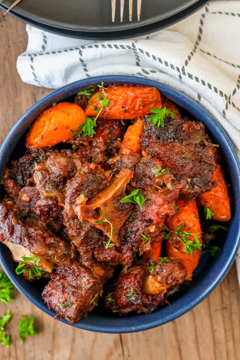 Oxtail with herbs and carrots in Bowl