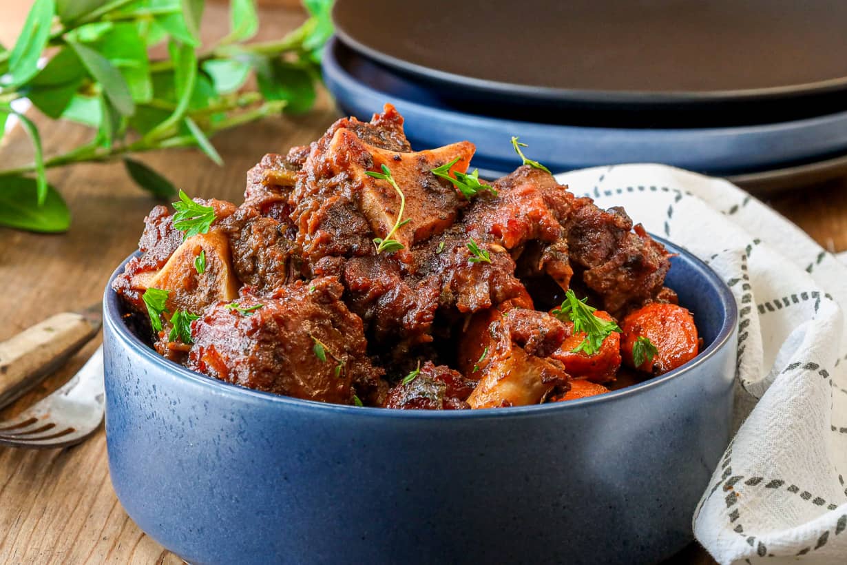 smoked oxtail in blue bowl