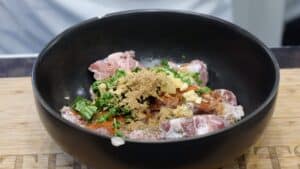 seasoning and meat in bowl