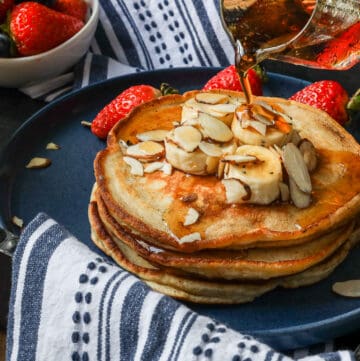 syrup pouring on pancakes