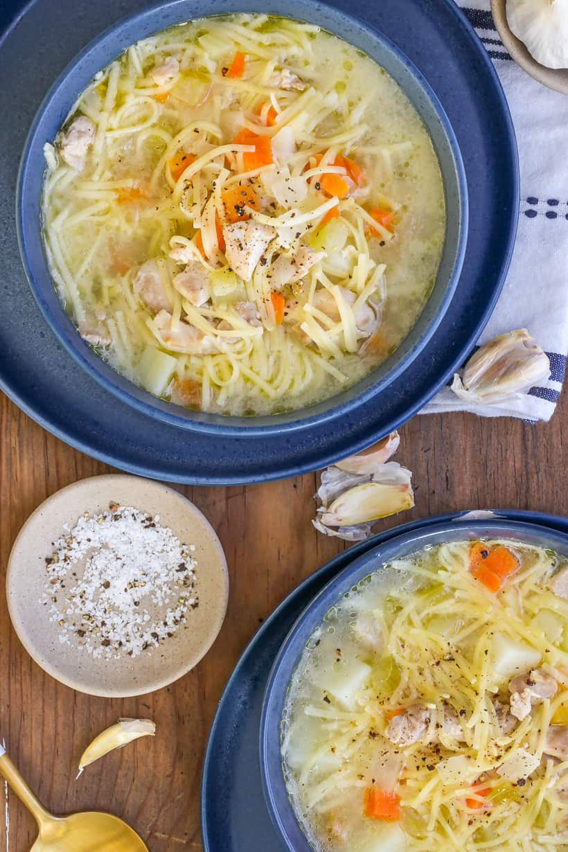 Chicken broth soup in bowls