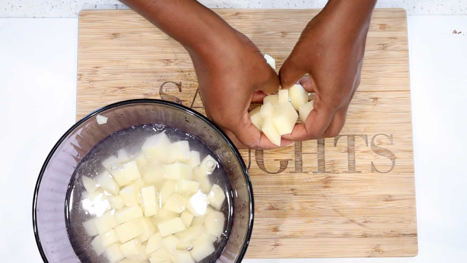 adding diced Potatoes to bowl