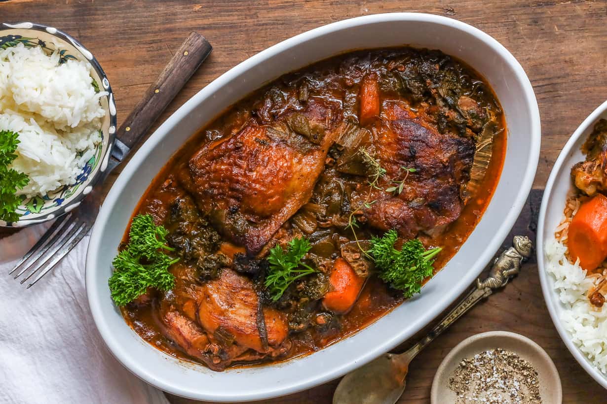 kale with chicken in white bowl