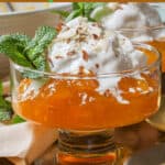 Kabak Tatlisi Turkish pumpkin dessert recipe in glasses topped with ice cream and nuts Pin