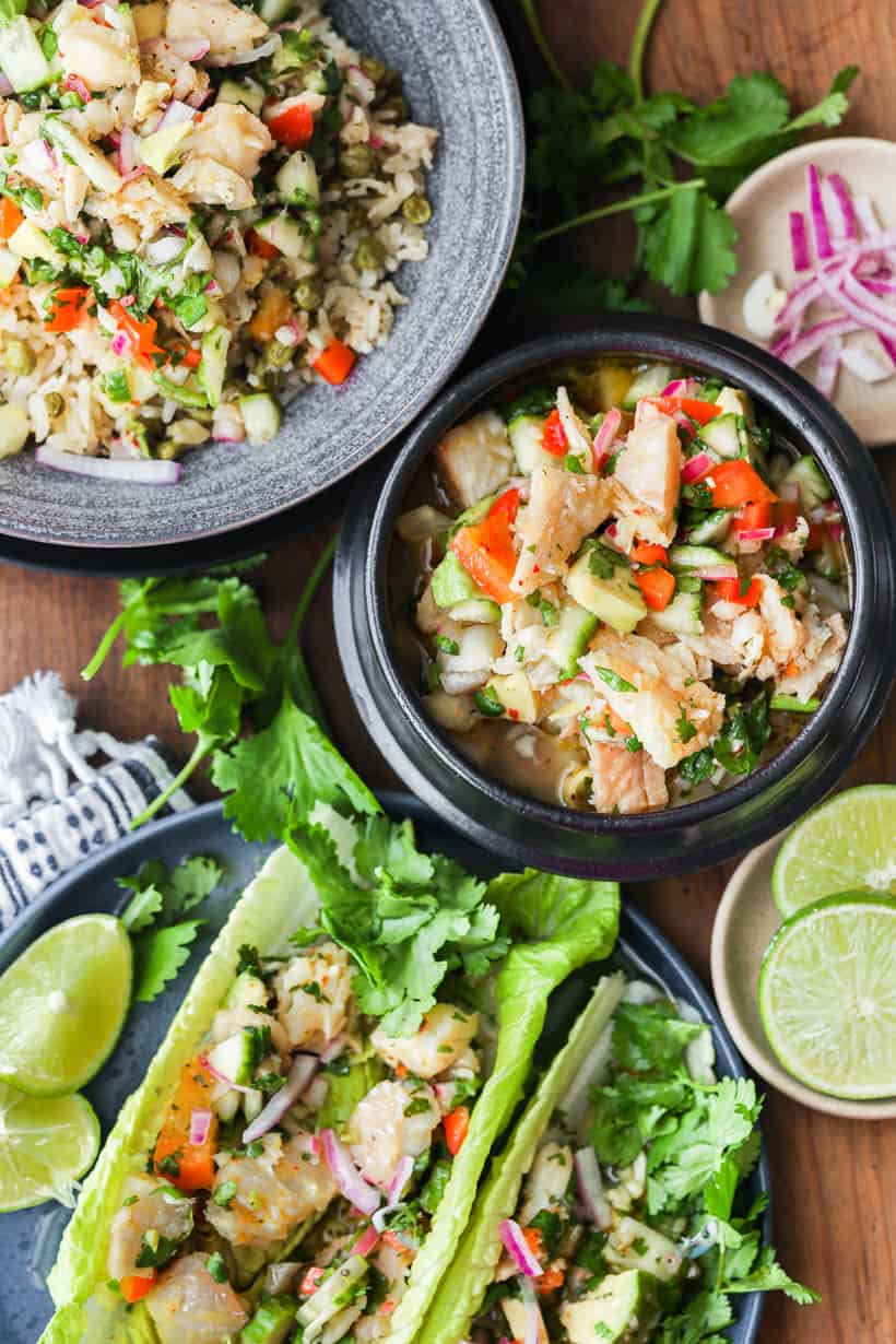 ceviche over rice and lettuce in black bowl