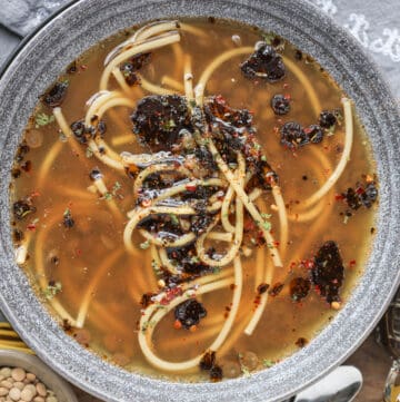 green lentils soup in gray bowl