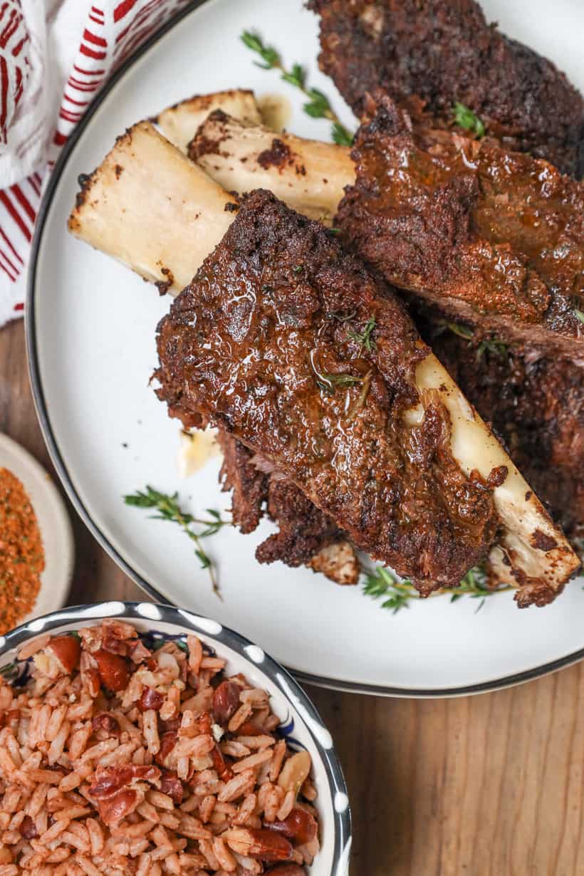 slow-cooked jerk ribs on white plate