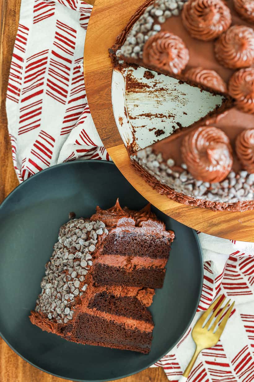 slice of death by chocolate cake on black plate