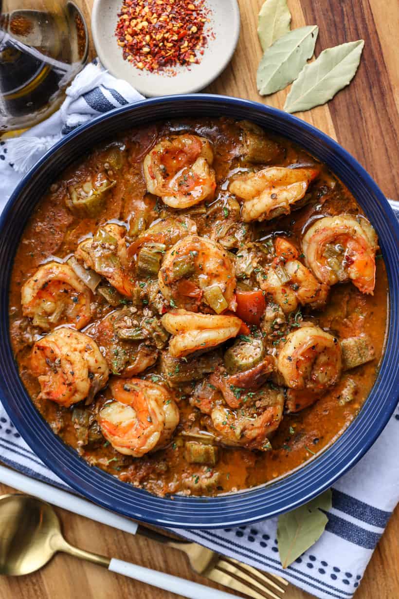 Smothered okra with shrimp and tomatoes in bowl