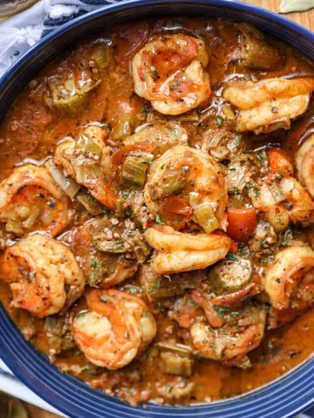 smothered okra, shrimp, and tomatoes in blue bowl