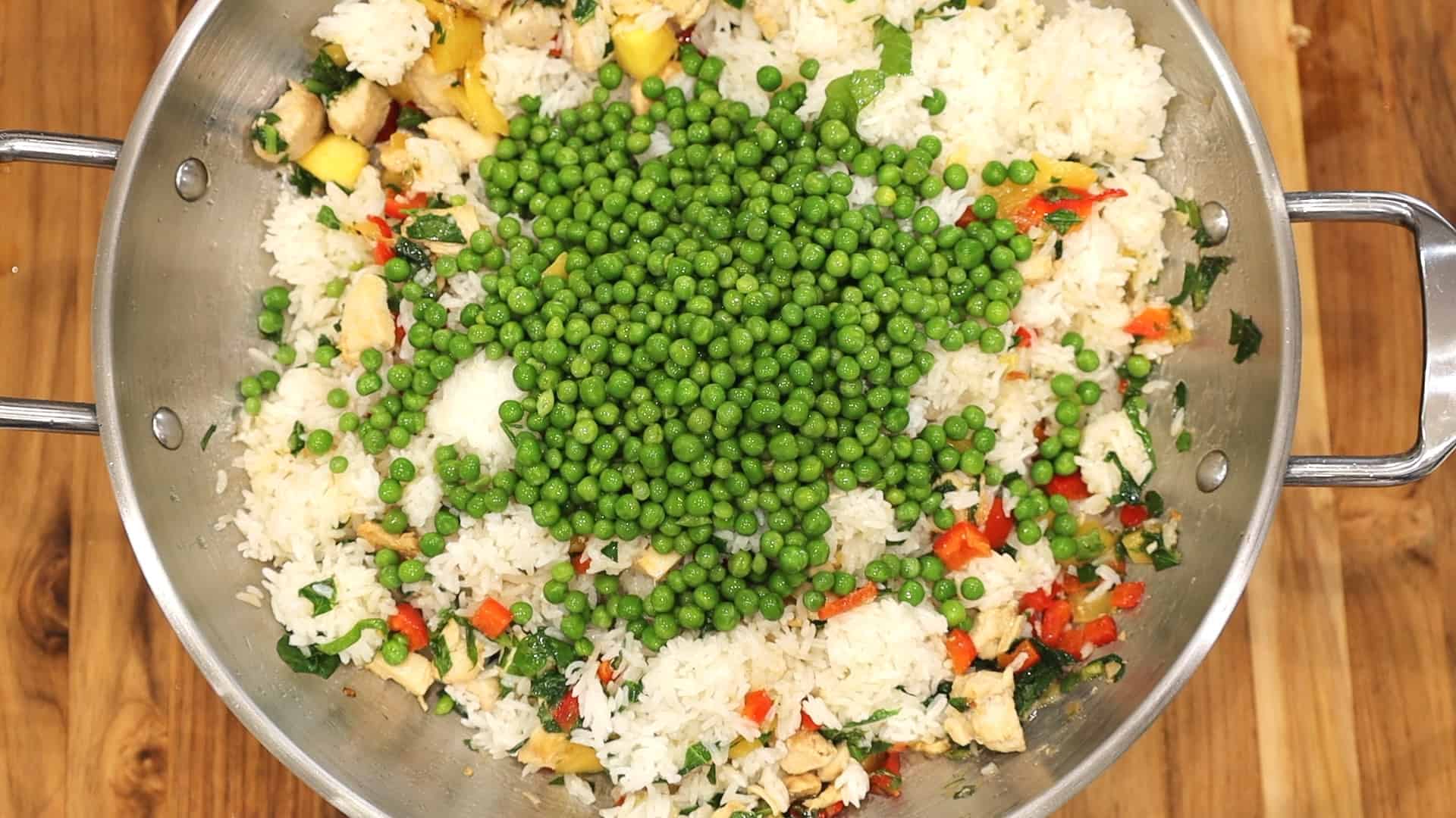 ADDING PEAS TO MANGO FRIED RICE