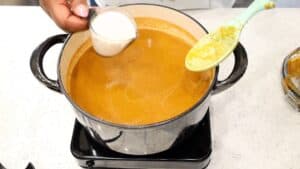 adding creamer to the soup