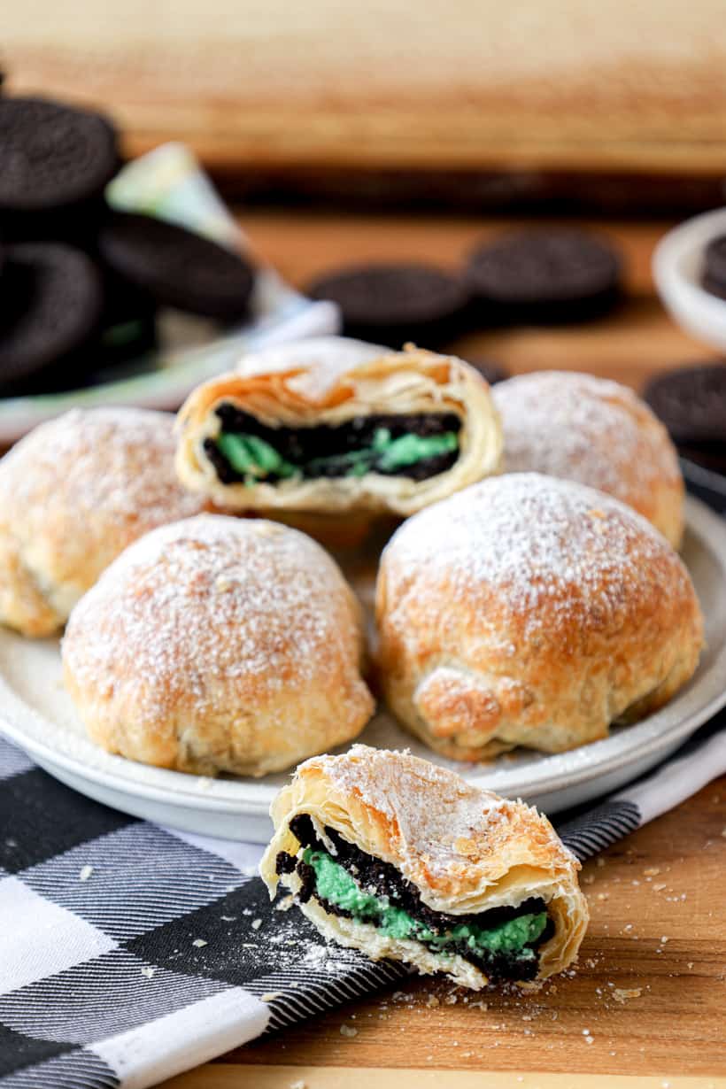 Air Fried Oreos on a plate with one split in half.