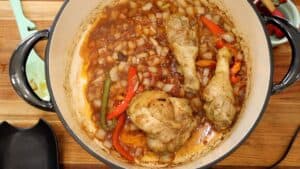 Chicken, onions, and peppers in a large pot