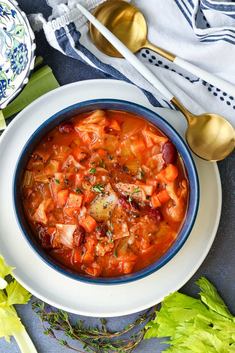 Delicious instant pot cabbage soup in a blue bowl.
