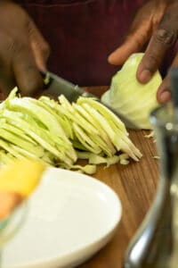 Slicing Cabbage on wooden board.