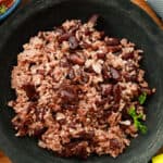 Diri Ak Pwa Rouj in black bowl and thyme