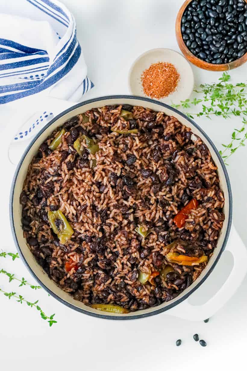 Cooked Haitian black beans and rice in dutch oven.