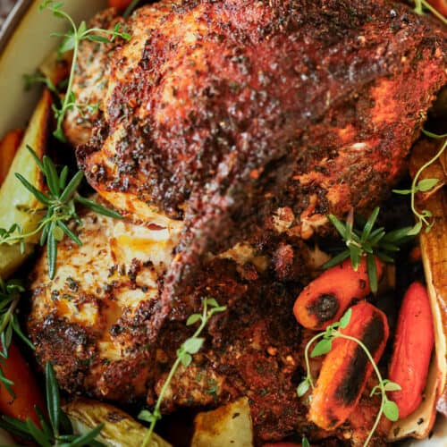 Air fryer turkey breast in dish with roasted potatoes and carrots