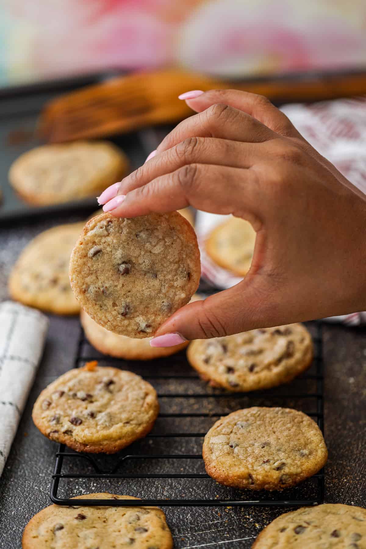 Hand holding browned butter chocolate chip cookies