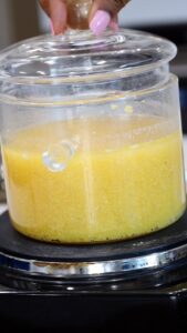 Cornmeal cooking in glass cooking dish