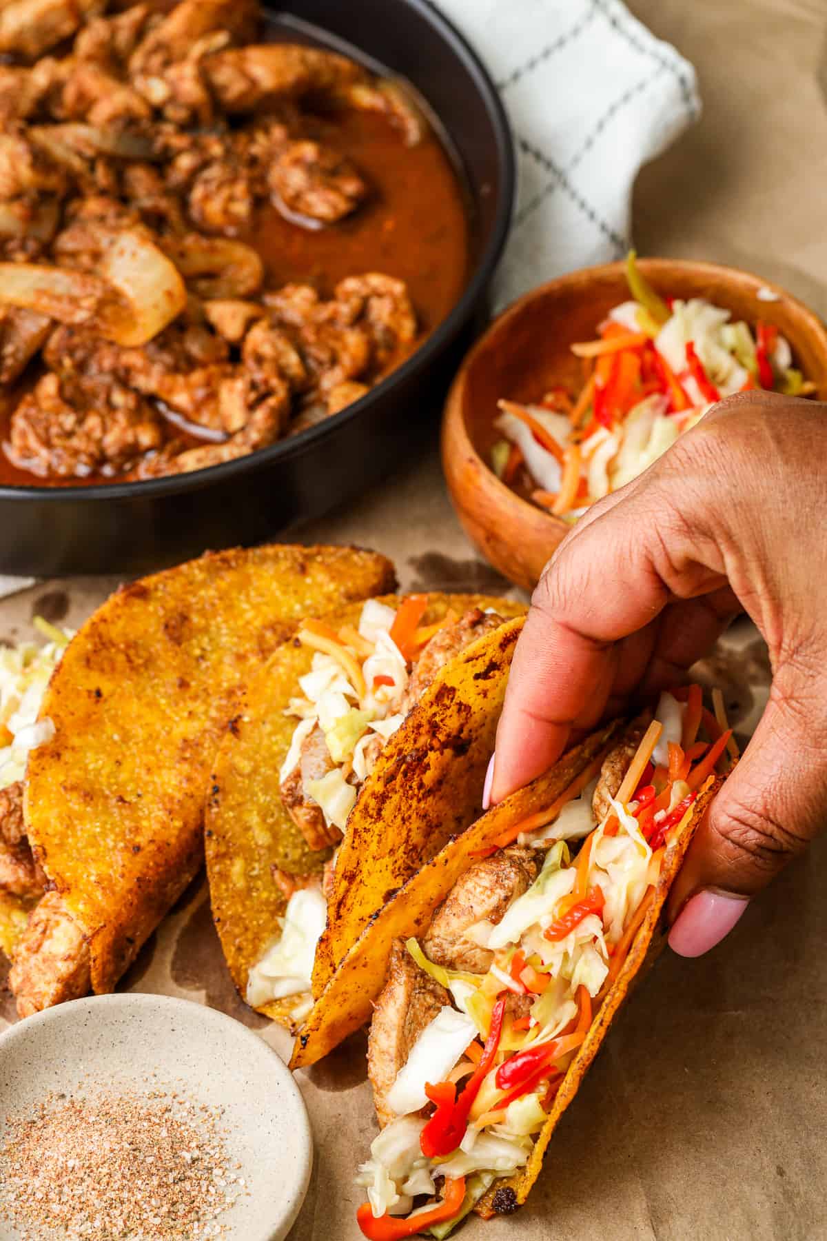 Hand holding Haitian Chicken Tacos