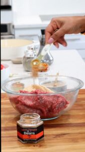 Learn how to make harissa meatballs with Haitian Bèlans spice blend