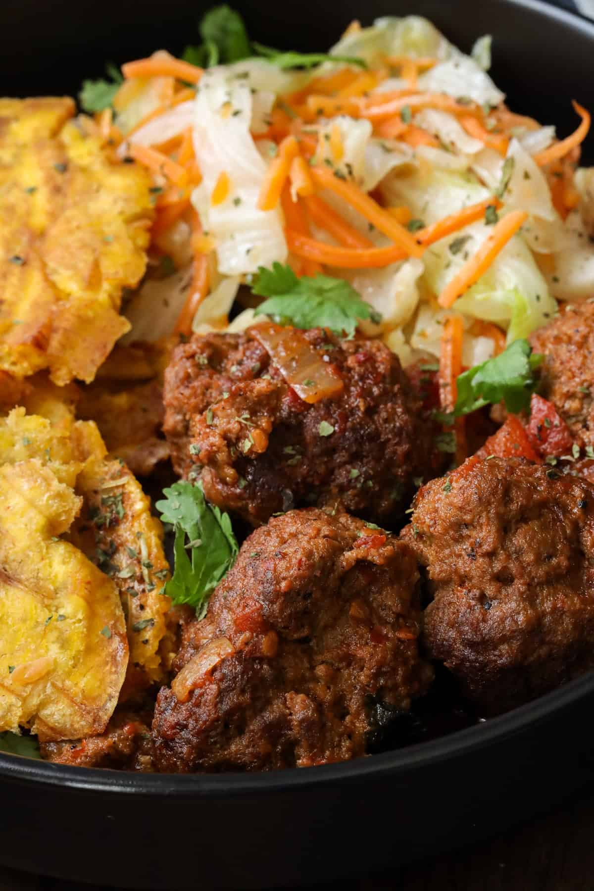 Learn how to make the best Harissa meatballs and learn how to pair with with Jamaican steamed cabbage and Haitian Fried Plantains.
