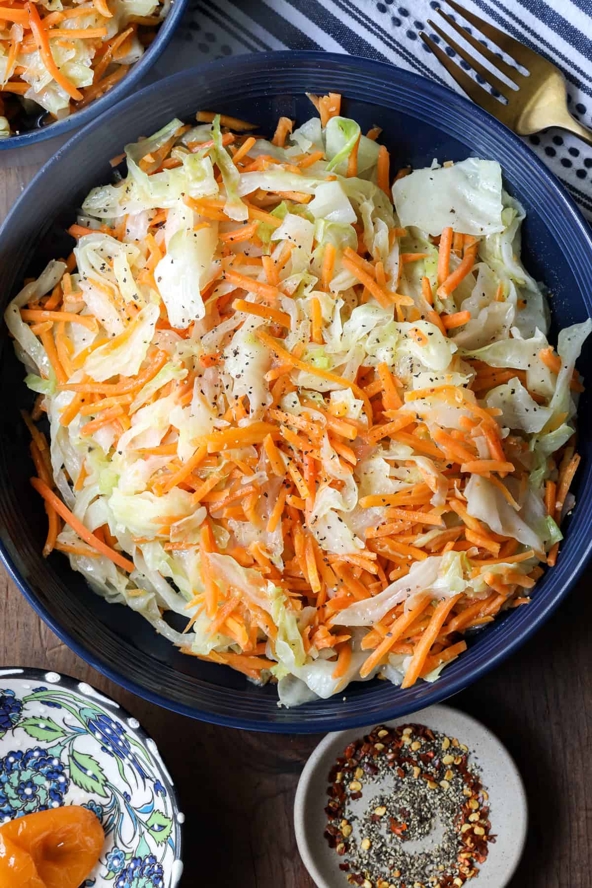 Steamed cabbage Jamaican Style prepared with carrots in blue plate