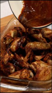 Adding sauce to chicken wings